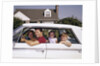 1960s Father And Mother With Son And Daughter Sitting In White Four Door Sedan Automobile by Anonymous