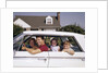 1960s Father And Mother With Son And Daughter Sitting In White Four Door Sedan Automobile by Anonymous