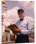 1950s 1960s Mechanic Holding Check List On Clipboard by Anonymous