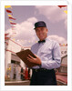 1950s 1960s Mechanic Holding Check List On Clipboard by Anonymous