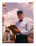 1950s 1960s Mechanic Holding Check List On Clipboard by Anonymous