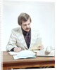 1970s Business Man At Desk Handling Paperwork Office Telephone by Anonymous