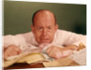 1960s Angry Man Businessman Desk Full Of Bills Paper Work Office Stress Frustration by Anonymous
