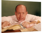 1960s Angry Man Businessman Desk Full Of Bills Paper Work Office Stress Frustration by Anonymous