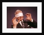 1960s Blindfolded Senior Man Businessman Arms Reaching Grasping Feeling Way by Anonymous