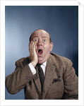 1960s Balding Businessman Holding Hand Up To Face Shocked Expression Eyes Bulging Mouth Open by Anonymous
