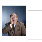 1960s Balding Businessman Holding Hand Up To Face Shocked Expression Eyes Bulging Mouth Open by Anonymous