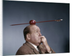 1960s Anxious Business Man Biting Finger With Nails Arrow Shot Through Apple On Of His Top Head by Anonymous