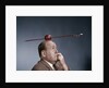 1960s Anxious Business Man Biting Finger With Nails Arrow Shot Through Apple On Of His Top Head by Anonymous