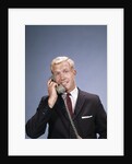 1960s Young Businessman Salesman Talking On Telephone by Anonymous