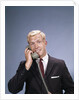 1960s Young Businessman Salesman Talking On Telephone by Anonymous