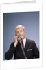 1960s Young Businessman Salesman Talking On Telephone by Anonymous