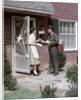 1950s Mailman Delivering Mail To Woman Brick Suburban Home by Anonymous
