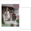 1950s Mailman Delivering Mail To Woman Brick Suburban Home by Anonymous