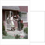 1950s Mailman Delivering Mail To Woman Brick Suburban Home by Anonymous