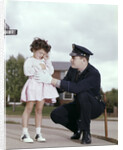 1960s Man Police Officer Comforting Crying Scared Little Lost Girl In Suburban Neighborhood by Anonymous