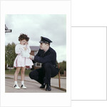 1960s Man Police Officer Comforting Crying Scared Little Lost Girl In Suburban Neighborhood by Anonymous