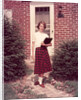 1950s Teenage Girl Holding School Books Walking Down Flagstone Walk by Anonymous