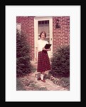 1950s Teenage Girl Holding School Books Walking Down Flagstone Walk by Anonymous