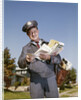 1960s Mailman Holding Letters Mail Leather Mailbag In Suburban Neighborhood by Anonymous