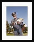 1960s Mailman Holding Letters Mail Leather Mailbag In Suburban Neighborhood by Anonymous
