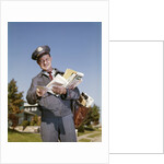 1960s Mailman Holding Letters Mail Leather Mailbag In Suburban Neighborhood by Anonymous