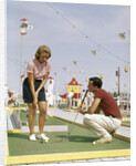 1950s 1960s Young Couple Man Woman Play Miniature Golf Summer Amusement by Anonymous