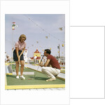1950s 1960s Young Couple Man Woman Play Miniature Golf Summer Amusement by Anonymous
