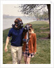 1970s Young Romantic Teenage Couple Man Woman Wearing Gas Masks Walking By River by Anonymous