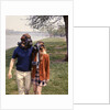 1970s Young Romantic Teenage Couple Man Woman Wearing Gas Masks Walking By River by Anonymous