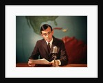 1960s Reporter Reading News Into Microphone With Global Map In Background by Anonymous