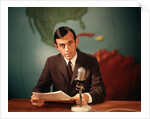 1960s Reporter Reading News Into Microphone With Global Map In Background by Anonymous