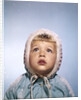 1960s Cold Little Girl In Winter Coat And Hood Looking Up At Falling Snow by Anonymous