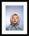 1960s Cold Little Girl In Winter Coat And Hood Looking Up At Falling Snow by Anonymous