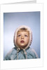 1960s Cold Little Girl In Winter Coat And Hood Looking Up At Falling Snow by Anonymous