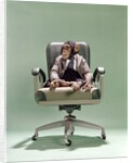 1970s Businessman Chimpanzee Sitting In Office Chair by Anonymous