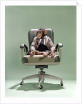 1970s Businessman Chimpanzee Sitting In Office Chair by Anonymous
