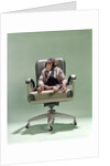 1970s Businessman Chimpanzee Sitting In Office Chair by Anonymous