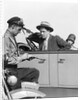 1920s Motorcycle Policeman Writing A Speeding Ticket To A Couple Sitting In Convertible Sedan by Anonymous