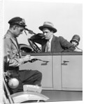 1920s Motorcycle Policeman Writing A Speeding Ticket To A Couple Sitting In Convertible Sedan by Anonymous