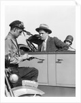1920s Motorcycle Policeman Writing A Speeding Ticket To A Couple Sitting In Convertible Sedan by Anonymous