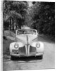 1940s 1941 Couple Man And Woman In Pontiac Convertible Driving On Country Lane In Countryside by Anonymous