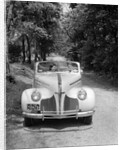 1940s 1941 Couple Man And Woman In Pontiac Convertible Driving On Country Lane In Countryside by Anonymous