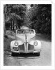 1940s 1941 Couple Man And Woman In Pontiac Convertible Driving On Country Lane In Countryside by Anonymous