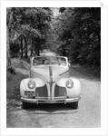 1940s 1941 Couple Man And Woman In Pontiac Convertible Driving On Country Lane In Countryside by Anonymous