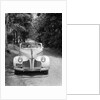 1940s 1941 Couple Man And Woman In Pontiac Convertible Driving On Country Lane In Countryside by Anonymous
