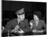1940s Soldier In Army Uniform And Girlfriend Sitting At Soda Fountain Counter Eating Dish Of Ice Cream by Anonymous