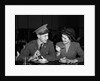 1940s Soldier In Army Uniform And Girlfriend Sitting At Soda Fountain Counter Eating Dish Of Ice Cream by Anonymous