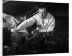 1950s Man Automotive Mechanic Servicing Car Engine by Anonymous
