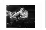 1950s Man Automotive Mechanic Servicing Car Engine by Anonymous
